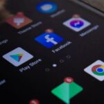 Detailed view of a smartphone screen with popular app icons including Facebook and Messenger.