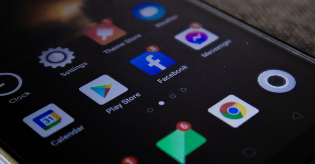 Detailed view of a smartphone screen with popular app icons including Facebook and Messenger.