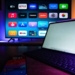A modern home setup with a smart TV and tablet displaying various streaming apps, highlighting the digital lifestyle.
