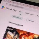 Close-up of a tablet displaying the Google Play Store interface in Russian.