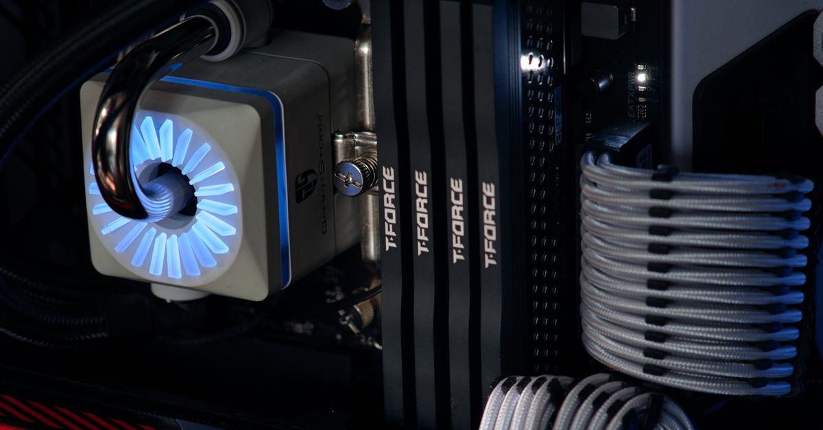 Detailed close-up of a computer cooling system featuring T-FORCE components and blue lighting.