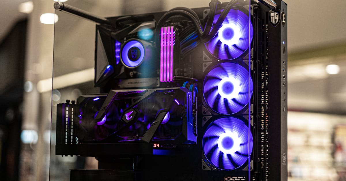Modern gaming computer with vibrant LED fans and sleek glass design, showcasing high-performance components.