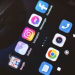 Smartphone screen showing popular social media and app icons including Facebook and Instagram.