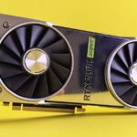 Close-up of a RTX 2080 Super graphics card against a bright yellow backdrop, showcasing high-tech design.