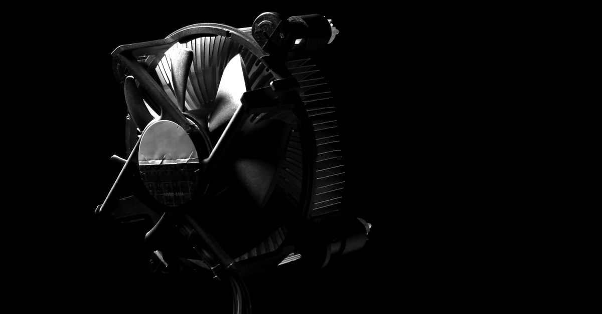 Elegant black and white photo of a CPU cooler with dramatic shadows, perfect for technology themes.